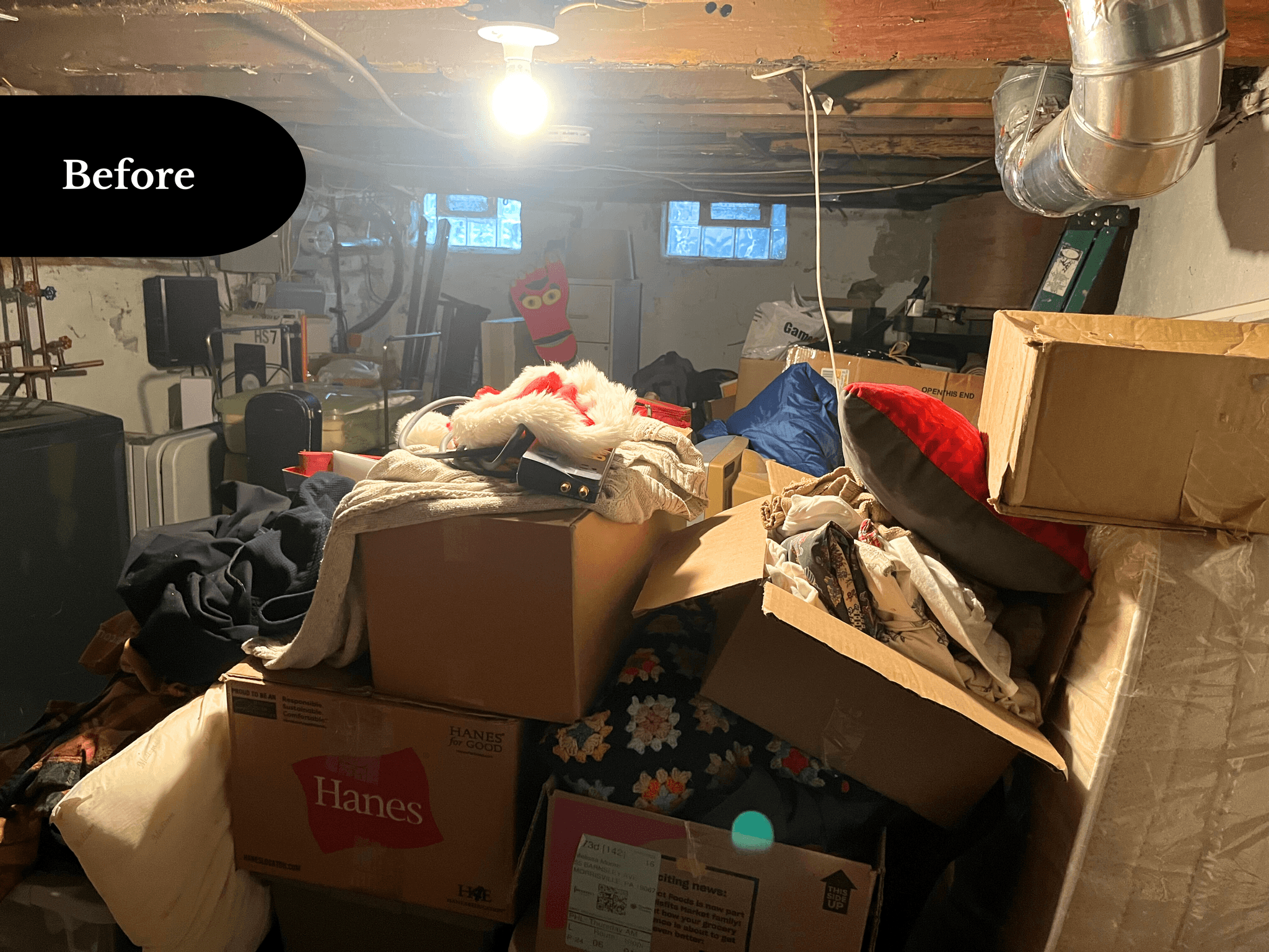 Cluttered basement filled with stored items, before transformation